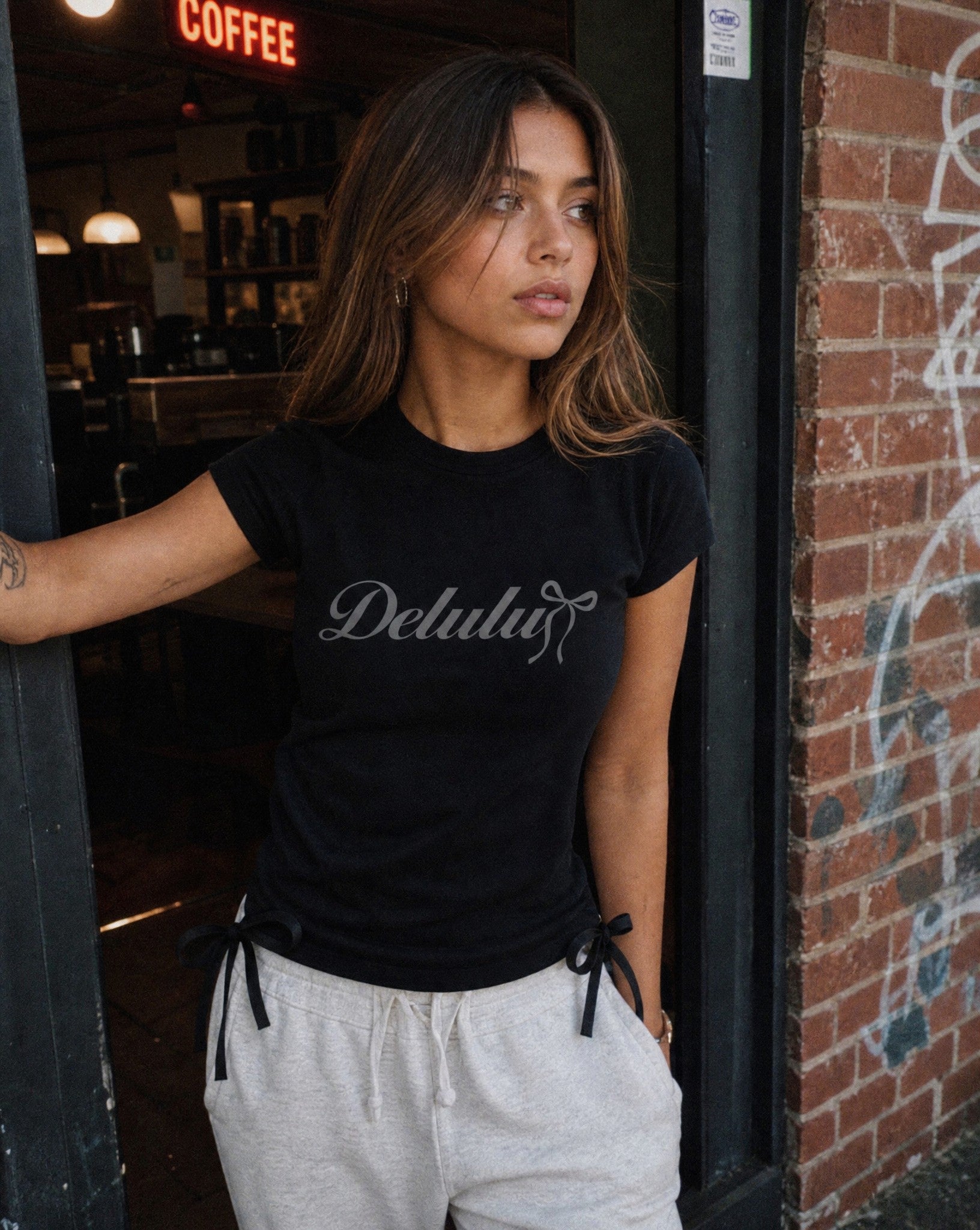Delulu Bow Tee in Black - Lifestyle Image